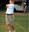 Kid golfing -