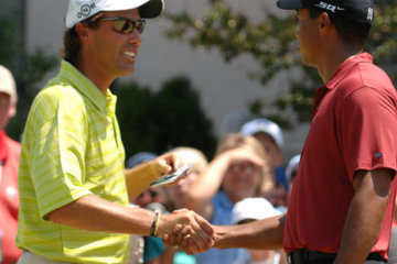 On the first tee Sunday, Stephen Ames congratulates Tiger Woods on winning the PGA Championship.