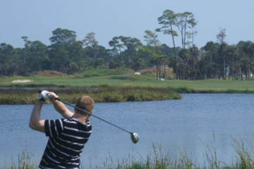 The par-4 ninth hole at Kiawah Island Golf Resort's Osprey Point golf course tees off over water.