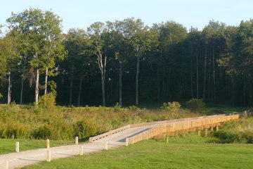 College Fields Golf Club's 13th hole starts with a daunting forced carry and a wood bridge.