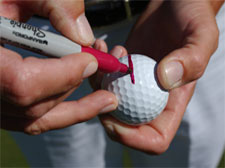 Draw a line on your golf ball with a permanent magic marker to help make it easier to see a straight line.