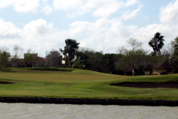 The par-3 15th at El Angel course at Rancho Viejo Resort & Country Club is one of a dozen holes that play over water.