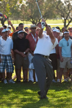 When using your pitching wedge from tall grass, move the ball back in your stance and make sure your hands are ahead of the ball.