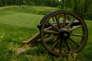 A cannon is positioned behind the 14th green at Cannon Ridge Golf Club in Fredericksburg, Va.