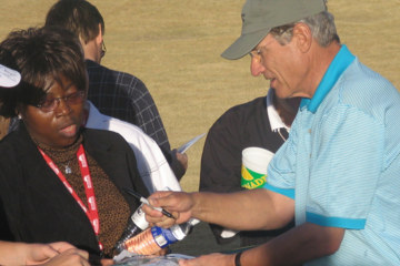 Maury Povich signs for a fan who said she attended a PGA Tour celebrity field event to see him.