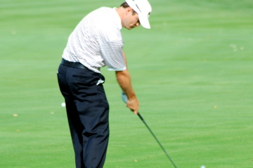 For middle irons, the ball should be played in the middle of the stance with the hands very slightly ahead of it.
