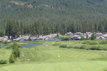 Plumas Pines Golf Resort plays out along the Feather River in a valley below the Tahoe-area mountains.