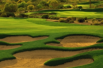 Estrella Mountain Ranch Golf Club's 13th hole is a 545-yard par 5 with an arroyo fronting the green.