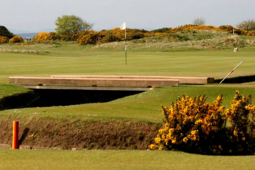 The Swilcan burn lies in front of the first green on the Old Course at St. Andrews. 