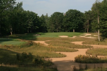 The par-3 fifth hole at Black Lake Golf Club features a waste bunker from tee to green. 