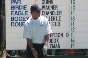 Former Bears quarterback Jim McMahon lines up a putt at a lake Tahoe celeberity tournament.