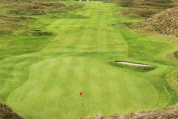 The view from atop the dunes looking back at the 15th green at The Island Golf Club. 