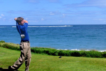Royal St. Kitts golf pro Sean Gradomski tees off on 16th hole.
