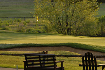 Chairs sit overlooking the 18th green at Circle C. After you are done playing, these seats look pretty appetizing.